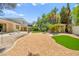 Expansive backyard featuring a beautiful home, lush greenery, and a tranquil gazebo for relaxation at 226 Dalmatian Ln, Las Vegas, NV 89107