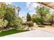 Lush backyard showcasing a tranquil waterfall feature, manicured landscaping, and charming bridge to the gazebo at 226 Dalmatian Ln, Las Vegas, NV 89107