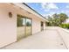 Wide balcony with sliding glass doors provides an exterior view of trees, sky, and neighborhood homes at 226 Dalmatian Ln, Las Vegas, NV 89107