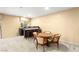 Spacious basement area with a wet bar, round table, and comfortable seating at 226 Dalmatian Ln, Las Vegas, NV 89107