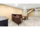 Basement area featuring a wet bar, seating area, and staircase leading to the upper level at 226 Dalmatian Ln, Las Vegas, NV 89107