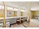 Bright bathroom highlighting the dual sink vanity and mirror, plus a view to an adjacent bathroom at 226 Dalmatian Ln, Las Vegas, NV 89107