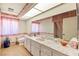 Retro bathroom with a large vanity, stylish sink, and classic floral accents at 226 Dalmatian Ln, Las Vegas, NV 89107