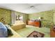 Bright bedroom with two twin beds, large dresser, and a sliding glass door to the outside at 226 Dalmatian Ln, Las Vegas, NV 89107