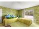 Bedroom with twin beds, a slider door, and green wallpaper at 226 Dalmatian Ln, Las Vegas, NV 89107