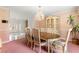Dining room boasts a chandelier and cabinet, adjacent to the main entry at 226 Dalmatian Ln, Las Vegas, NV 89107