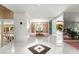 Bright foyer showcasing marble floors, mirrored walls, and an open floor plan leading to the dining area at 226 Dalmatian Ln, Las Vegas, NV 89107