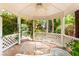 Inviting gazebo interior with seating, offering a tranquil view of the lush garden and surrounding greenery at 226 Dalmatian Ln, Las Vegas, NV 89107