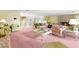 Spacious living room with pink carpet and floral wallpaper at 226 Dalmatian Ln, Las Vegas, NV 89107