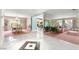 Open-concept living and dining area featuring marble floors, mirrored walls, and abundant natural light at 226 Dalmatian Ln, Las Vegas, NV 89107