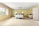 Spacious main bedroom with large window, neutral carpet, and vintage design at 226 Dalmatian Ln, Las Vegas, NV 89107