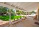 Covered patio and outdoor space, perfect for entertaining guests, overlooks a beautifully landscaped yard at 226 Dalmatian Ln, Las Vegas, NV 89107