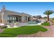 Private backyard oasis with a pool, patio, and lush landscaping at 2508 Faiss Dr, Las Vegas, NV 89134