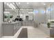 Bathroom features dual sinks, a soaking tub, a walk-in shower, and modern lighting at 2508 Faiss Dr, Las Vegas, NV 89134