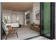 Bright bedroom boasts a fireplace, television, ensuite bathroom, and sliding glass doors to a patio at 2508 Faiss Dr, Las Vegas, NV 89134