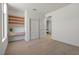 Bright bedroom with built-in desk and shelving, light wood floors, and sliding closet doors at 2508 Faiss Dr, Las Vegas, NV 89134