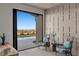 Bedroom sitting area with sliding glass doors leading to a pool and outdoor space at 2508 Faiss Dr, Las Vegas, NV 89134