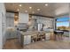 Spacious kitchen with stainless steel appliances, custom cabinets and views from a large window over the sink and dining nook at 2508 Faiss Dr, Las Vegas, NV 89134