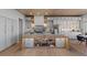 Gourmet kitchen with designer cabinets, lighting, and stainless steel appliances at 2508 Faiss Dr, Las Vegas, NV 89134