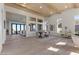 Open concept living/dining area featuring hardwood floors, modern furnishings, and seamless flow to an outdoor space at 2508 Faiss Dr, Las Vegas, NV 89134