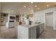 Open-concept living space featuring hardwood floors, built-in shelving, and modern furnishings at 2508 Faiss Dr, Las Vegas, NV 89134