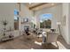 Bright living room with modern furniture, high ceilings, and a cozy fireplace at 2508 Faiss Dr, Las Vegas, NV 89134