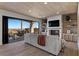 Cozy living room with fireplace, built-in shelving, and a large sliding glass door opening to the patio at 2508 Faiss Dr, Las Vegas, NV 89134