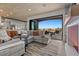 Bright living room with sliding glass doors to outside dining area at 2508 Faiss Dr, Las Vegas, NV 89134