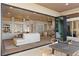Seamless indoor-outdoor living with sliding glass doors to the patio and modern kitchen at 2508 Faiss Dr, Las Vegas, NV 89134
