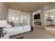 Serene main bedroom with modern fireplace and light-toned hardwood flooring throughout at 2508 Faiss Dr, Las Vegas, NV 89134