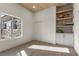 Bright office with a large window, built-in shelves, cabinets, and light wood floors at 2508 Faiss Dr, Las Vegas, NV 89134