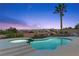 Enjoy this refreshing pool with an attached spa and city views from the backyard at 2508 Faiss Dr, Las Vegas, NV 89134