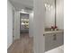 Contemporary powder room featuring a sleek vanity with gray cabinets and stylish fixtures at 2508 Faiss Dr, Las Vegas, NV 89134