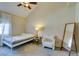 Vaulted ceiling bedroom featuring a quaint bed, chair, and full-length mirror at 2925 Wigwam Pkwy # 1124, Henderson, NV 89074