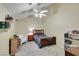 Well lit bedroom with a ceiling fan, small bed and organized bookcase at 2925 Wigwam Pkwy # 1124, Henderson, NV 89074