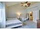 Bright bedroom featuring a vaulted ceiling and a doorway to the ensuite bathroom at 2925 Wigwam Pkwy # 1124, Henderson, NV 89074
