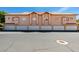 Building exterior showcasing garage doors and stucco facade at 2925 Wigwam Pkwy # 1124, Henderson, NV 89074