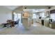 Bright kitchen with breakfast bar, stainless appliances, and adjacent dining area at 2925 Wigwam Pkwy # 1124, Henderson, NV 89074