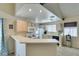 Well-lit kitchen with breakfast bar and an open concept design at 2925 Wigwam Pkwy # 1124, Henderson, NV 89074