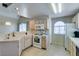 Bright kitchen showcases light wood cabinets, modern appliances, and a cozy breakfast nook at 2925 Wigwam Pkwy # 1124, Henderson, NV 89074