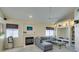 Living room with fireplace, built-in shelving, and modern ceiling fan at 2925 Wigwam Pkwy # 1124, Henderson, NV 89074