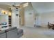 Spacious living room featuring vaulted ceilings, built-in shelving, and neutral carpet at 2925 Wigwam Pkwy # 1124, Henderson, NV 89074