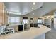 Bright kitchen with breakfast bar open to the living room with fireplace at 2925 Wigwam Pkwy # 1124, Henderson, NV 89074