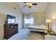Vaulted primary bedroom with light, neutral colors, ceiling fan, and ensuite bath at 2925 Wigwam Pkwy # 1124, Henderson, NV 89074