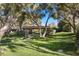 Secluded backyard with mature trees and desert landscaping, providing a private and serene outdoor retreat at 2961 Augusta Dr, Las Vegas, NV 89109