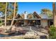 Stunning backyard featuring a unique pool design and architectural home with floor to ceiling windows at 2961 Augusta Dr, Las Vegas, NV 89109