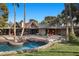 Expansive backyard featuring an in-ground pool with an architectural design at 2961 Augusta Dr, Las Vegas, NV 89109