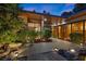 Front exterior featuring sleek modern design, tranquil water feature, and thoughtfully landscaped surroundings at 2961 Augusta Dr, Las Vegas, NV 89109