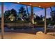 Covered patio offering city views, a calming water feature, and comfortable seating for relaxation at 2961 Augusta Dr, Las Vegas, NV 89109