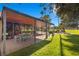 Covered patio with a dining area and a view of the manicured backyard at 2961 Augusta Dr, Las Vegas, NV 89109